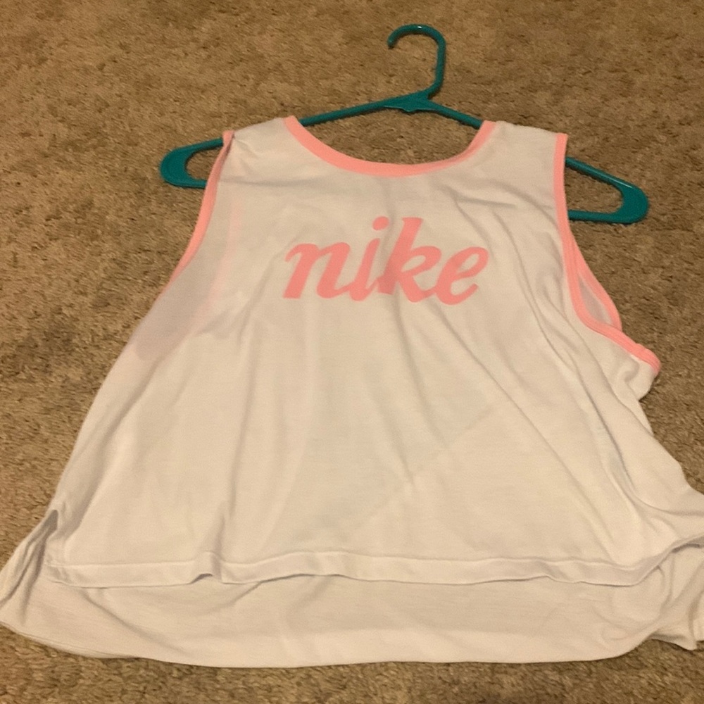 Womens nike tank top, medium, and white with pink detailing.